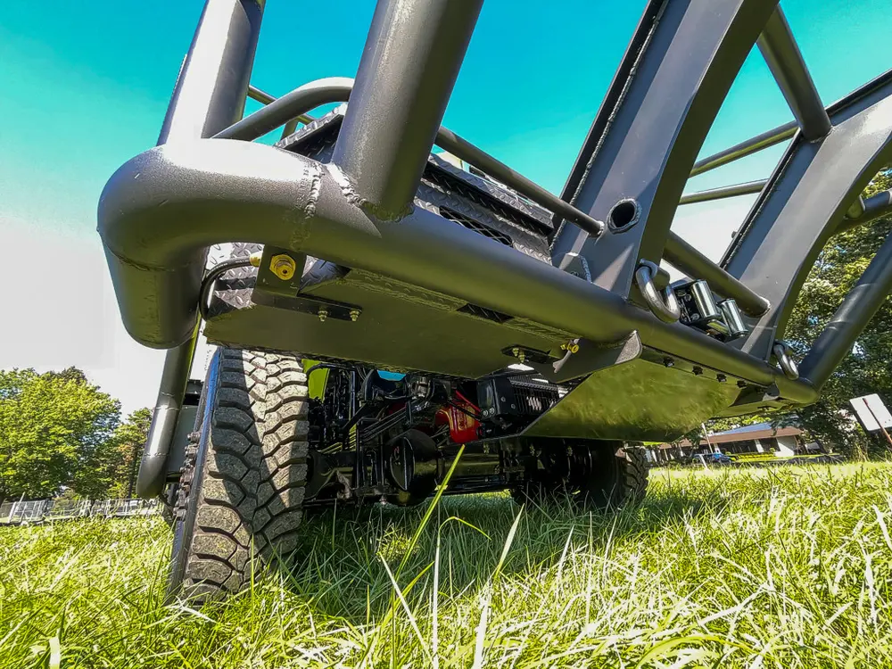 Brush guard corner and side step viewed from low angle.