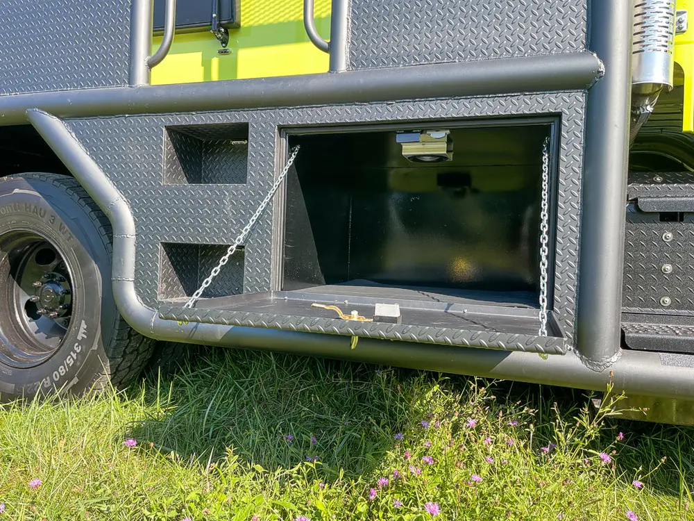 Long lower side compartment door opened outward.