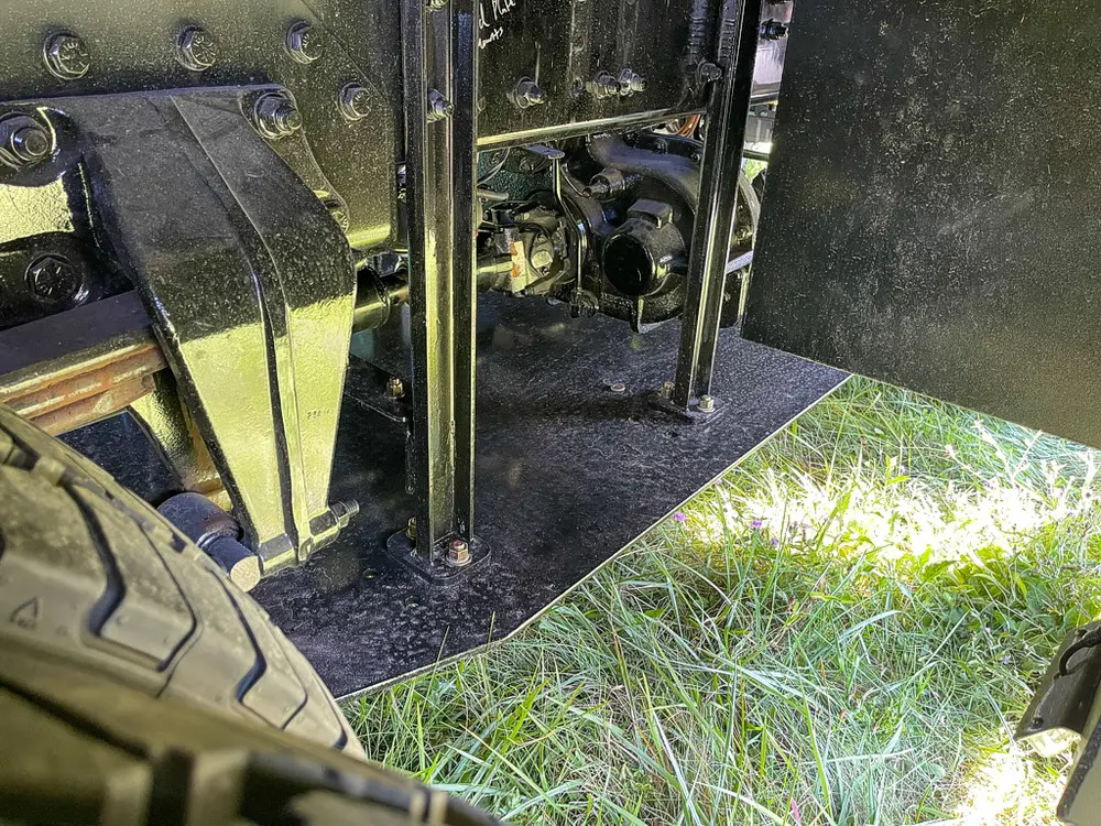 Open side compartment interior with dark floor panel.