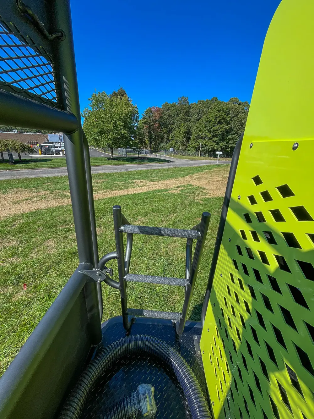 Walkway exit at rear corner with ladder and side rail.