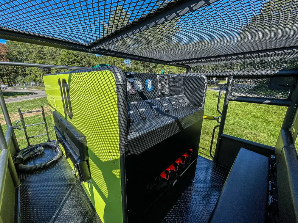 Rear side walkway with hose tank and black side shelf.