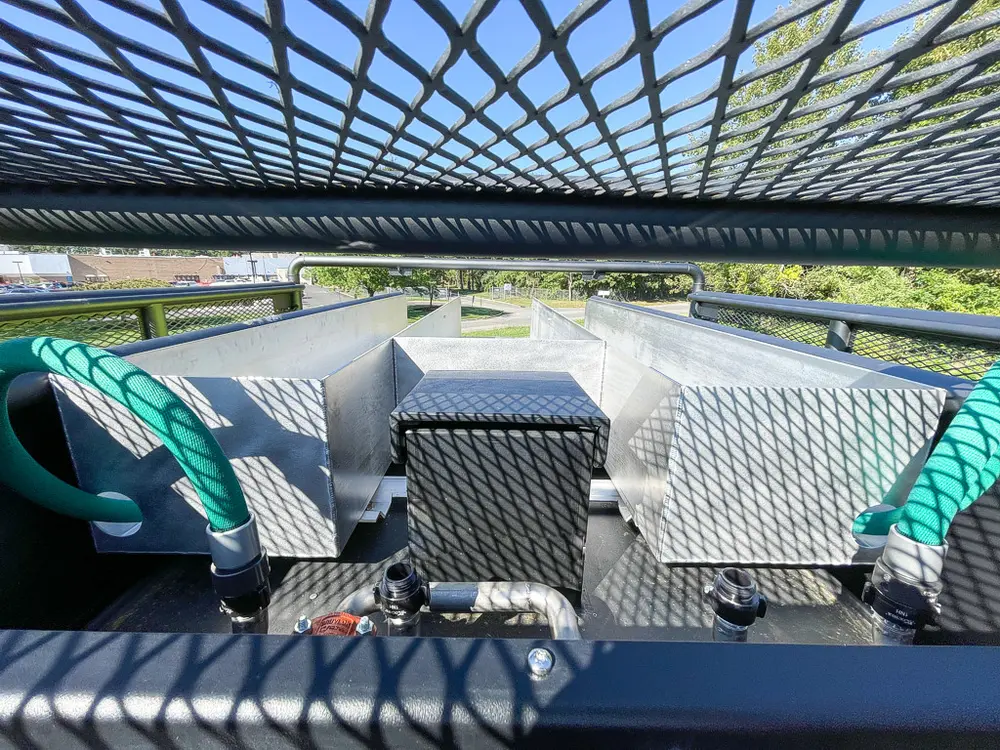 Top rear deck showing large tank and coiled hoses.