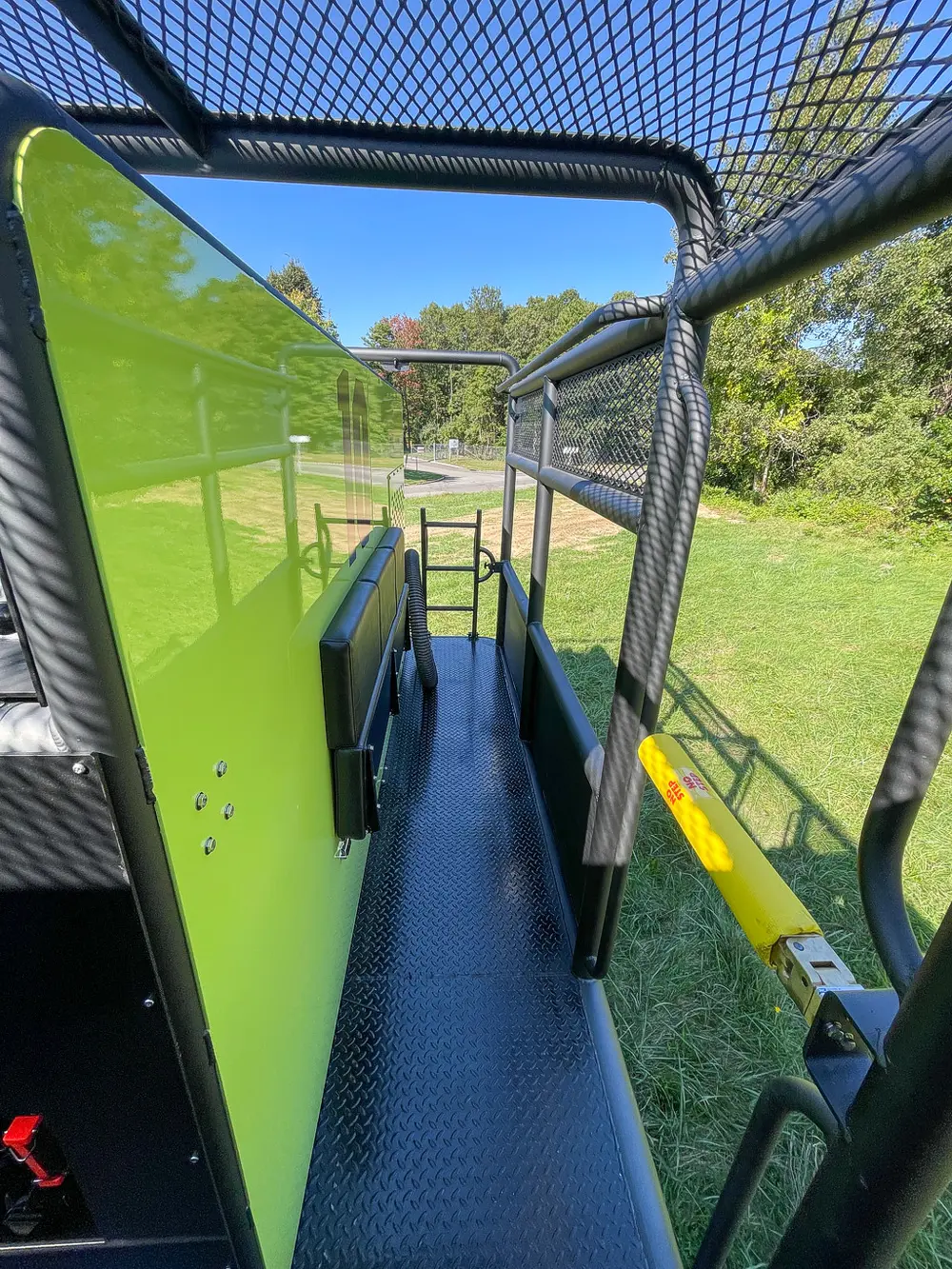 Walkway beside body panel with side shelf and ladder.