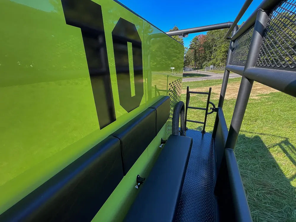 Long side view of panel and walkway with cage railing.