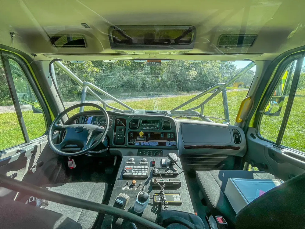Cab interior wide shot showing dashboard and center control console.
