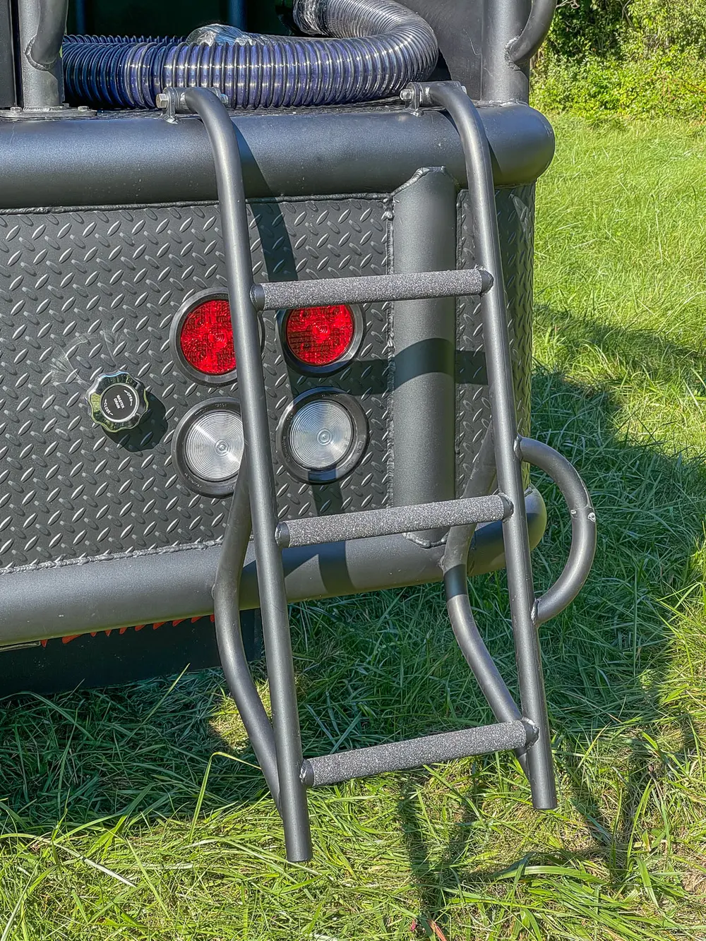 Close-up of red and white rear marker lights.