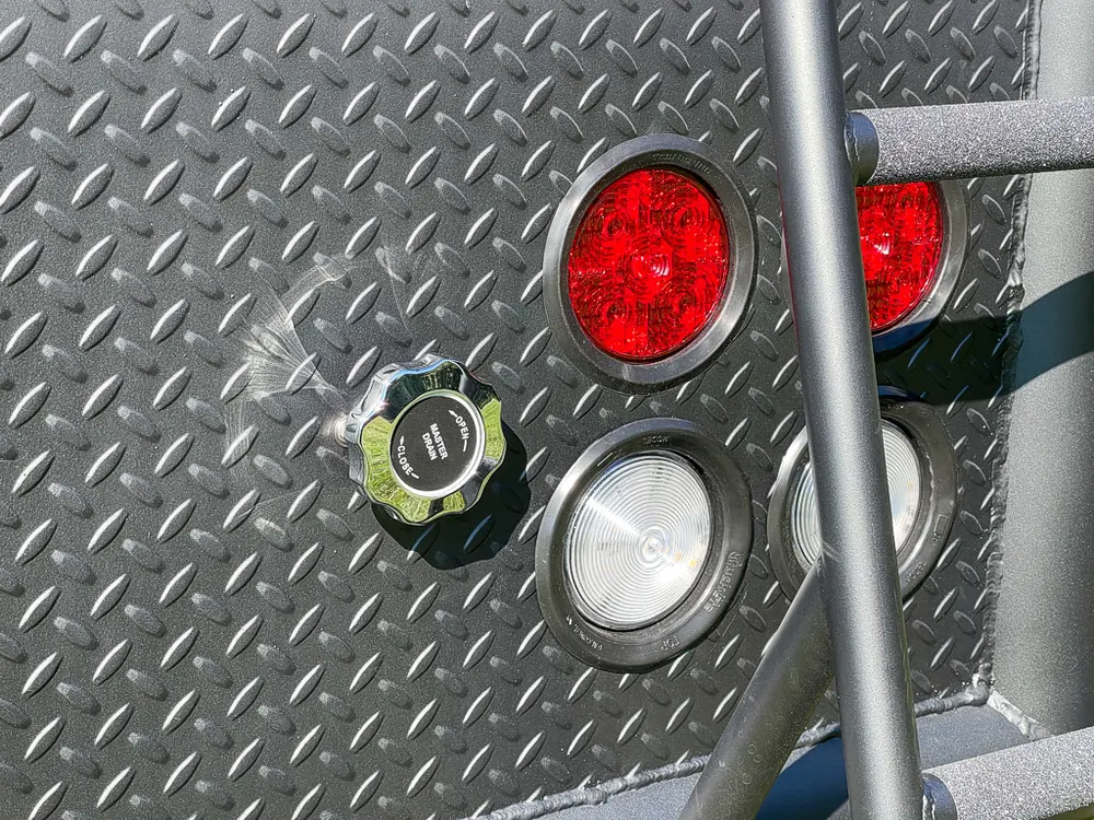 Close-up of side marker light and rear body fasteners.