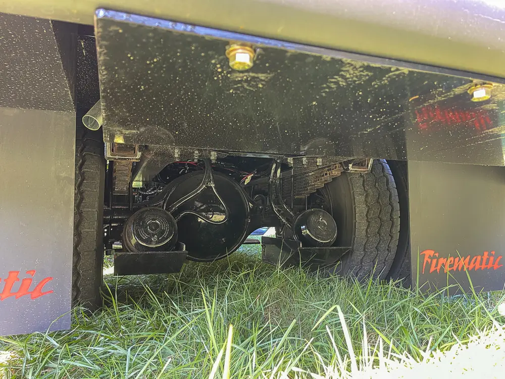 Underbody pump components visible from low rear side angle.