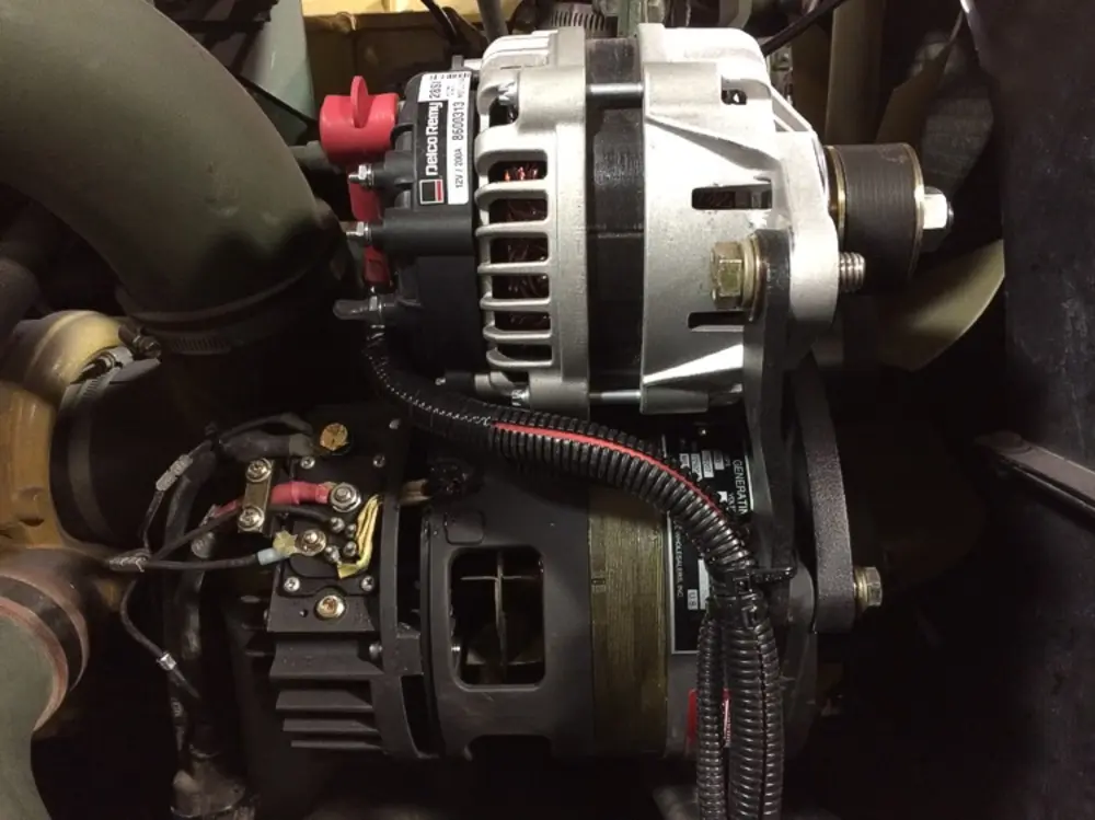 Exterior view of small fire truck showing cab, body compartments, and wheel/tire area.