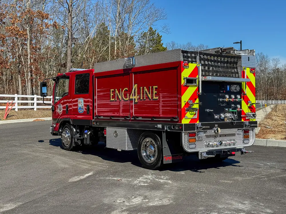 Rear-left angle showing side body and rear control area.