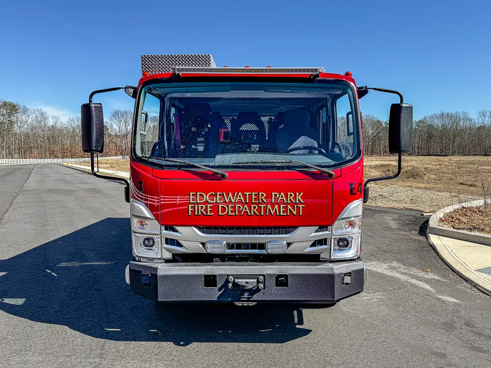 Head-on front view with windshield, grille, and bumper.