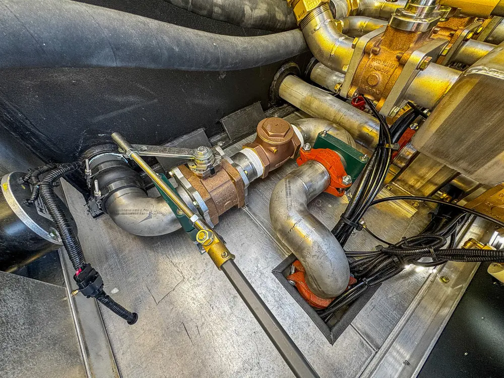 Close-up of pump manifold and brass valve assembly.