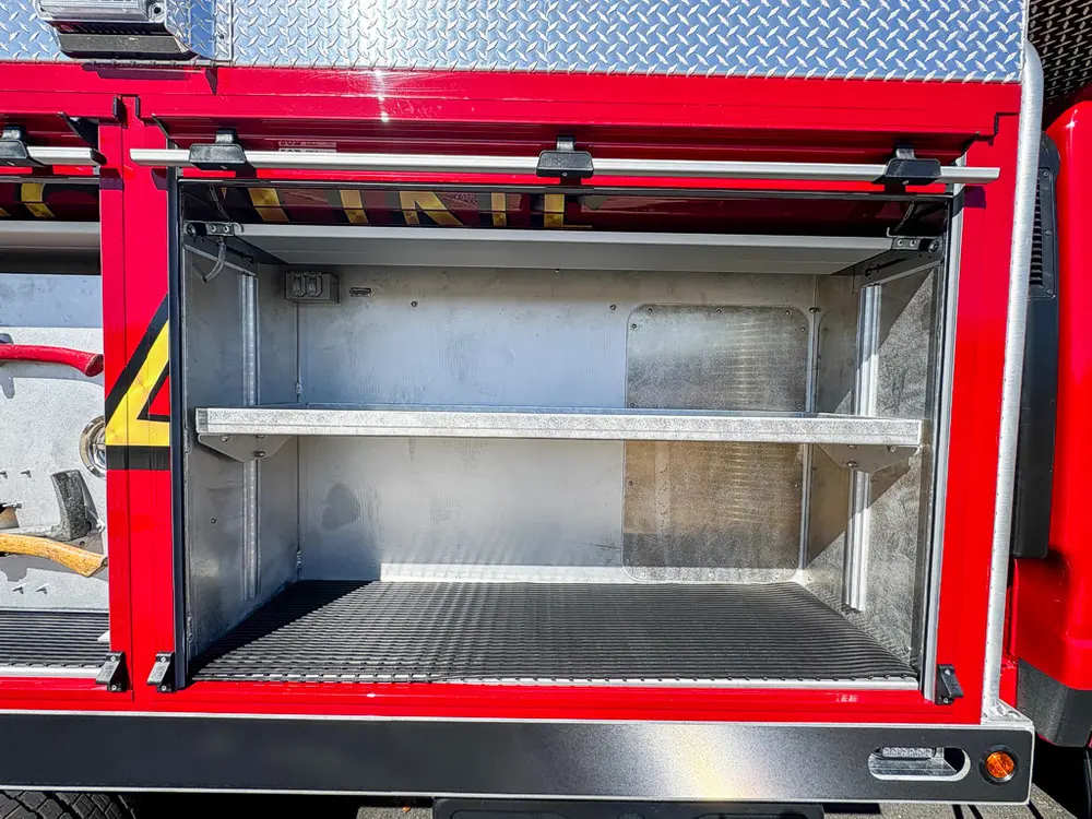 Open side compartment with two shelves and empty interior.