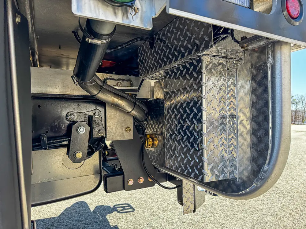 Rear underside close-up with hitch and nearby chassis hardware.