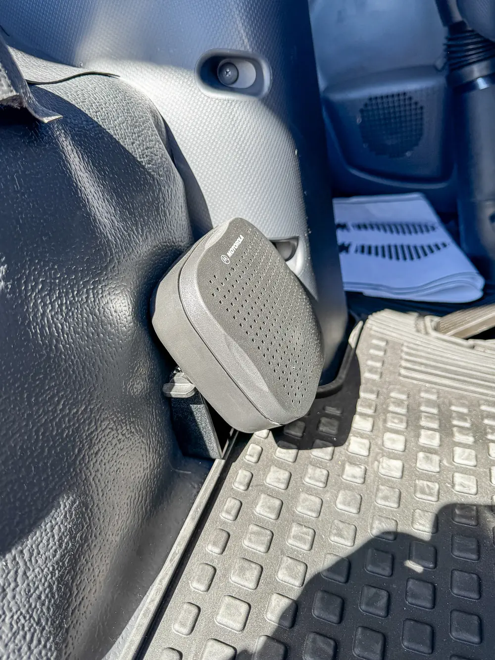 Cab interior pedal close-up near the lower side wall.