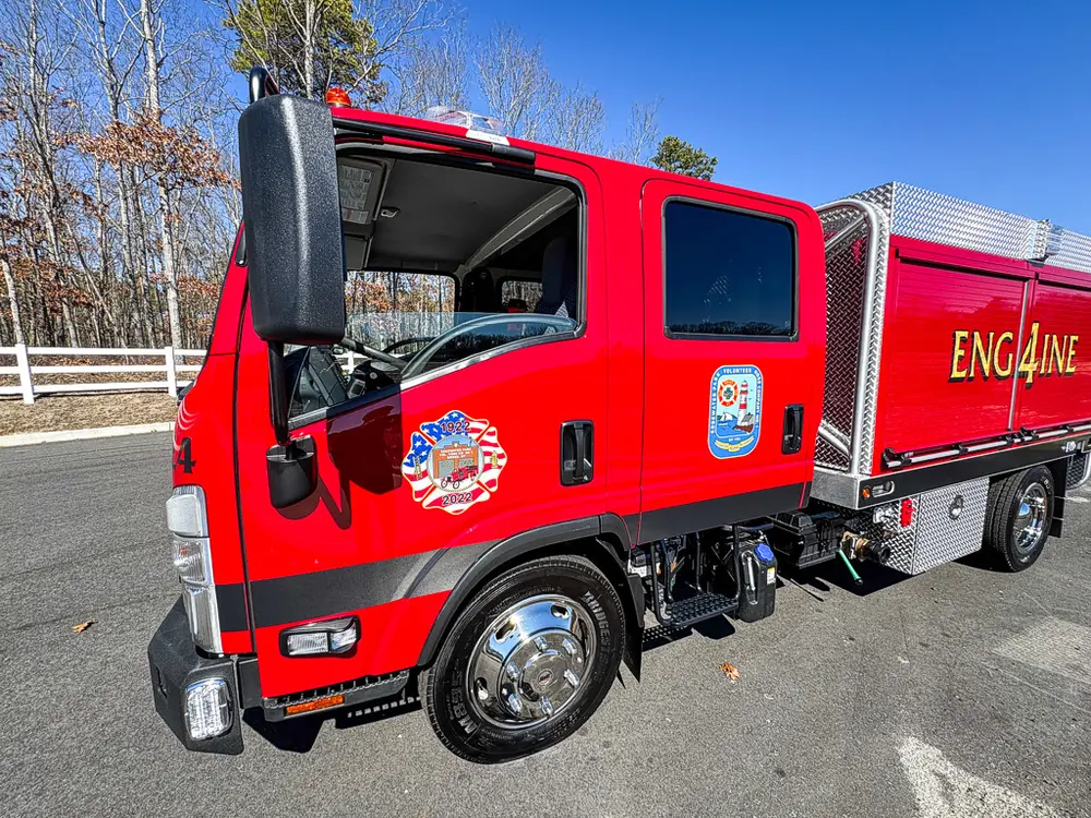 Driver-side cab with door open and steps visible.