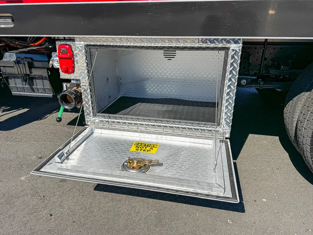 Open lower side compartment with fold-down tray and empty interior.