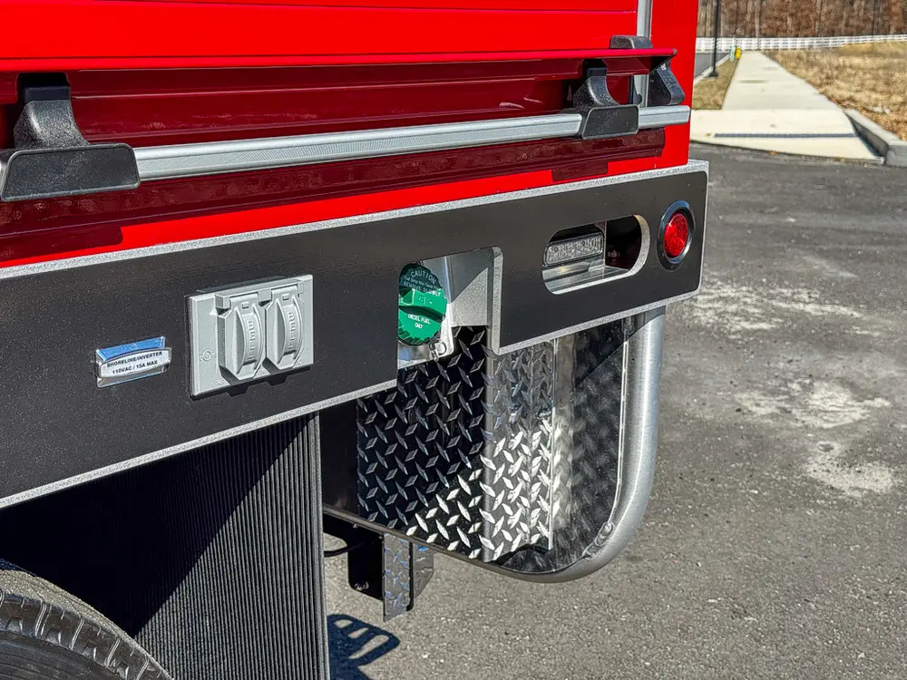 Lower right side body with warning labels and step area.