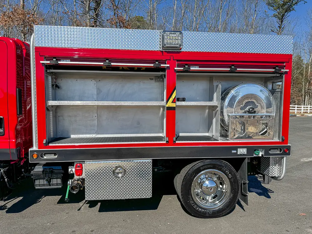 Open long side compartment with shelves and equipment space.