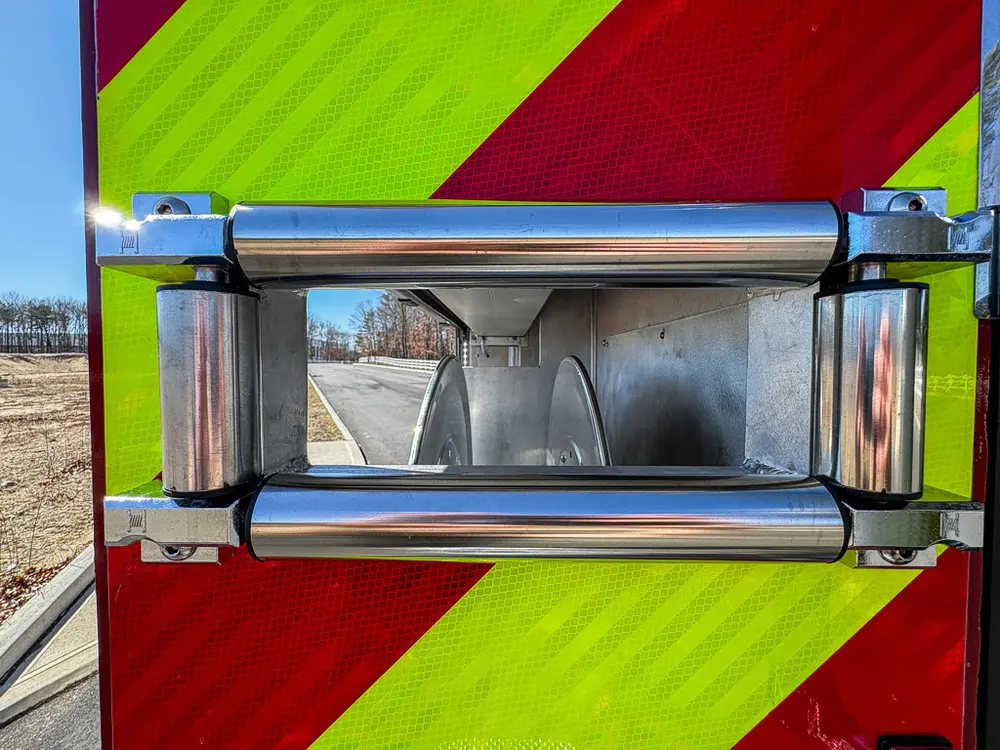 Rear chevron panel close-up with recessed grab handle and lights.