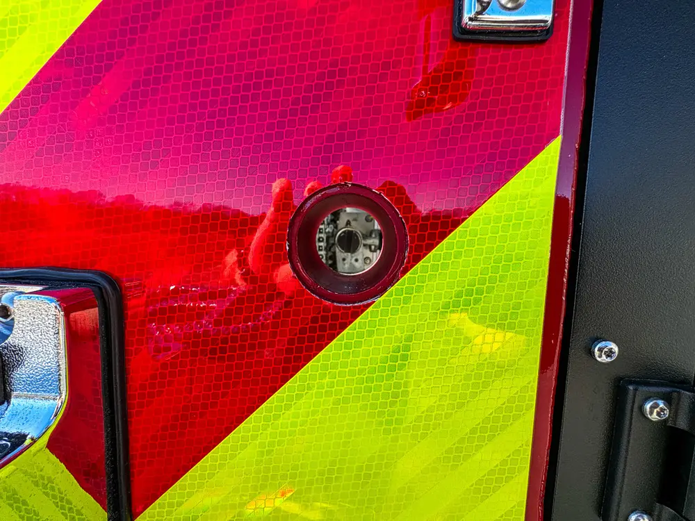 Rear chevron close-up with circular connector fitting.