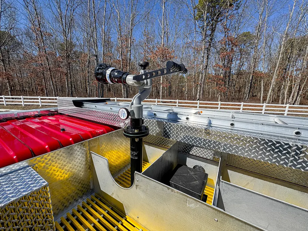 Upper deck close-up from rear quarter with deck monitor and rails.