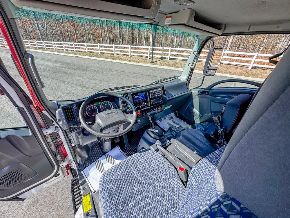 Wide cab interior view from the open side door.