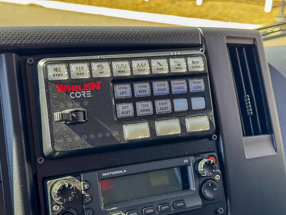Close-up of in-cab emergency control keypad and switches.