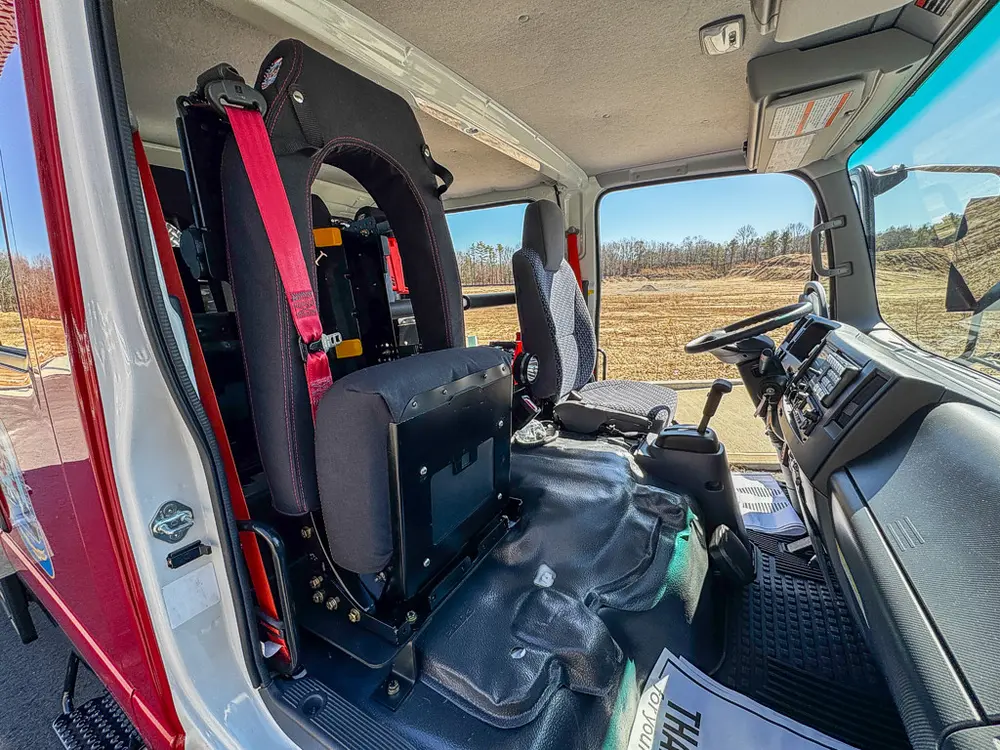 Passenger-side rear entry view with seat and interior panel.