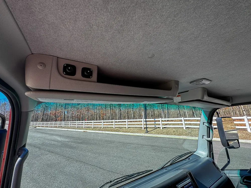 Interior roof shelf close-up above the windshield.