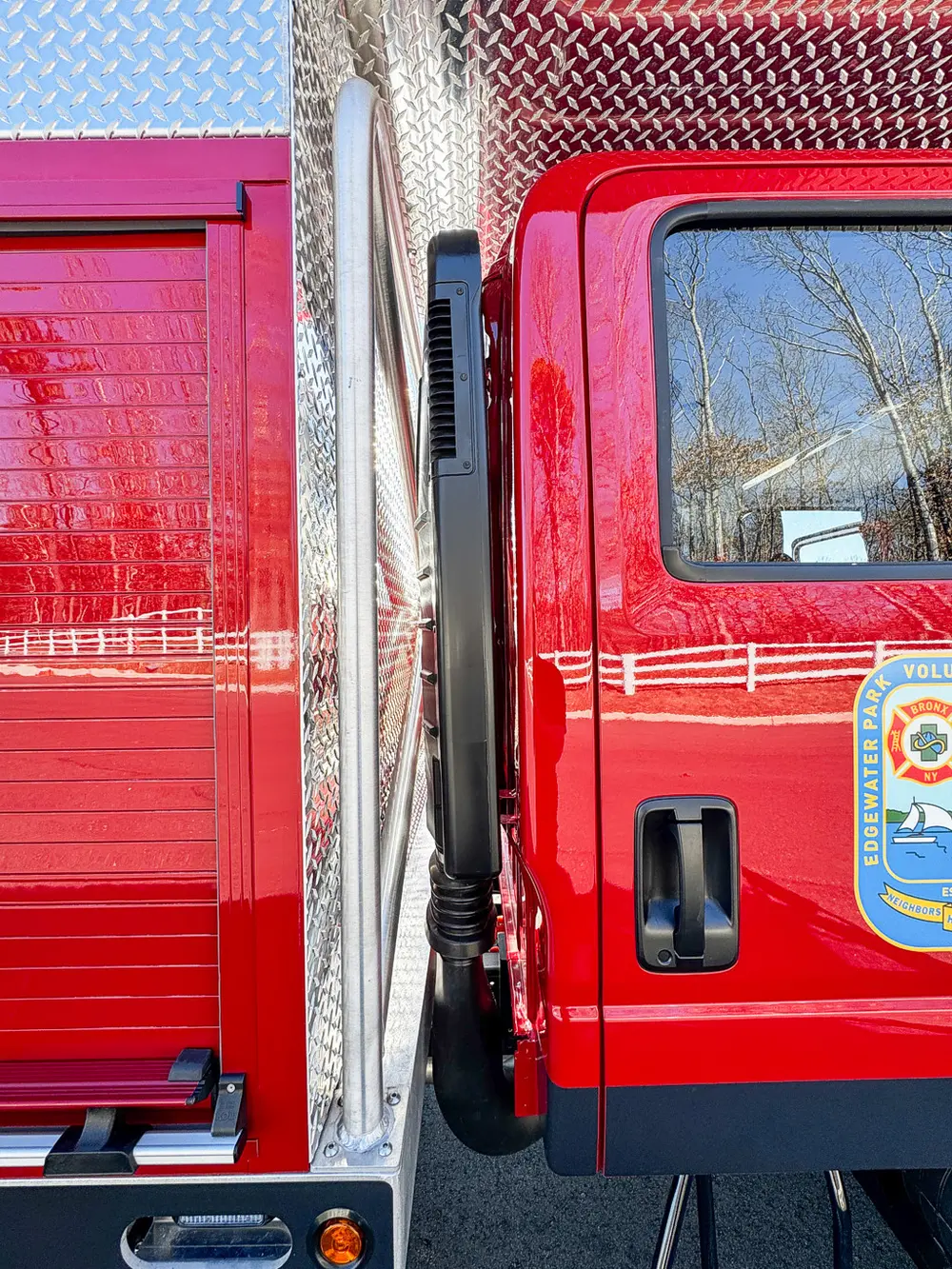 Exterior side body seam and door handle close-up.