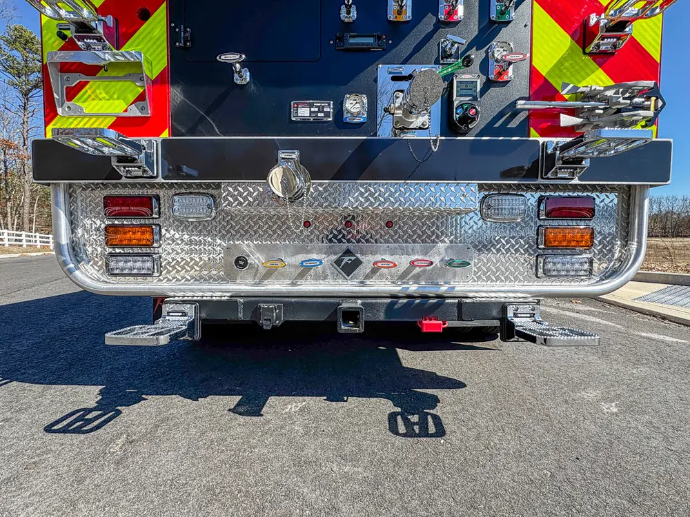 Full rear view with pump panel, lower step, and taillights.