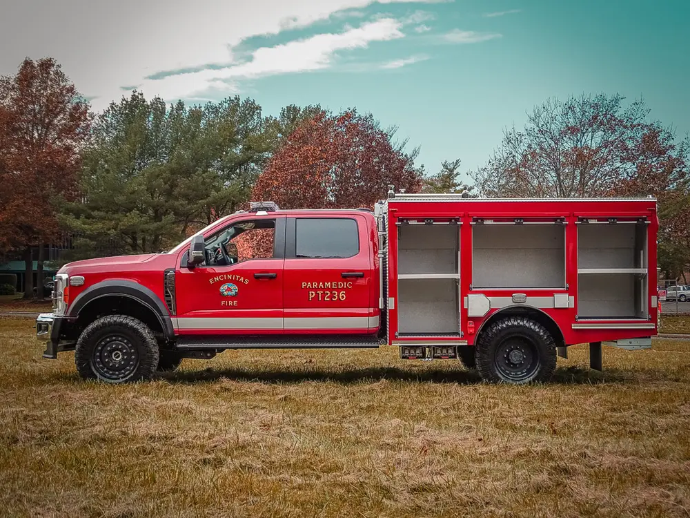 Driver-side view with lower compartment doors open.