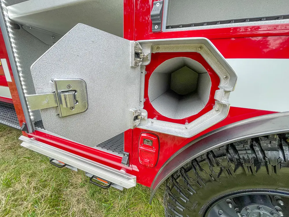 Open octagonal intake port door above rear wheel arch.