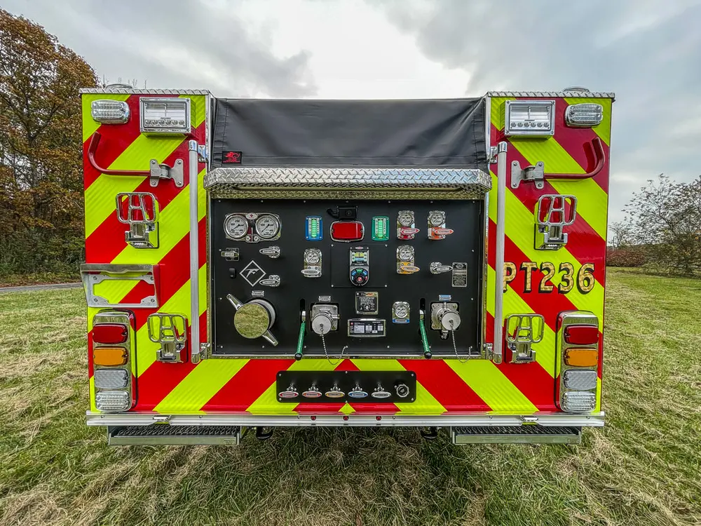 Rear pump panel wide view with controls and chevron doors.