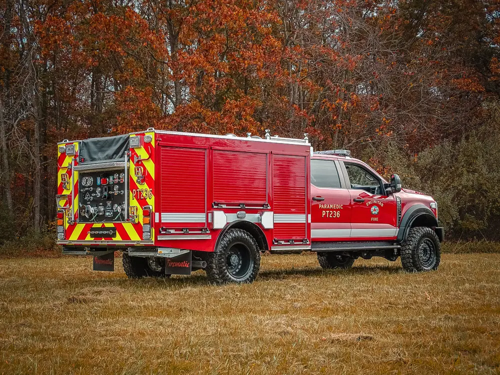 Rear three-quarter driver-side view of utility body and cab.