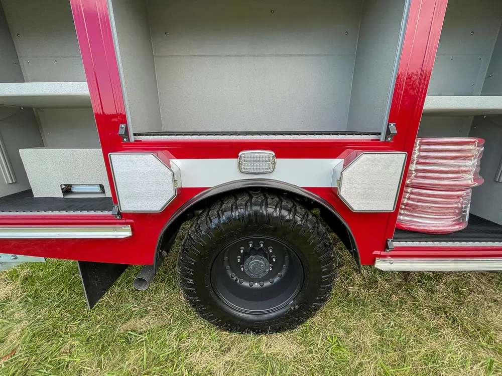 Passenger-side mid body section with compartment doors open.
