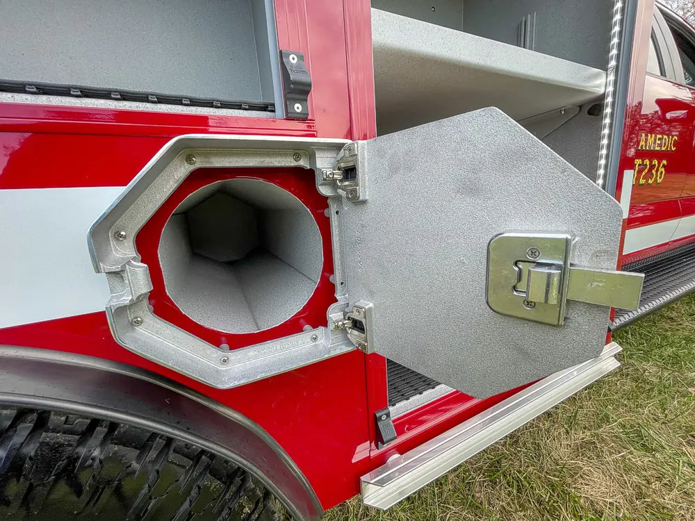 Second open side intake port close-up with hinged metal door.