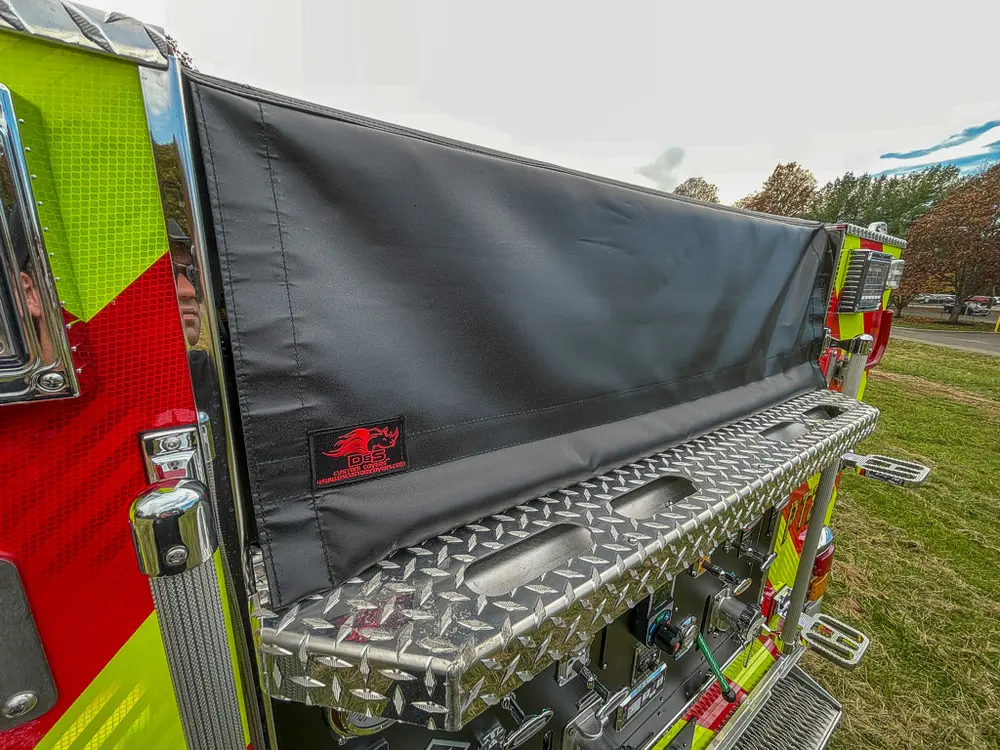 Top rear side walkway with rolled black hose cover.