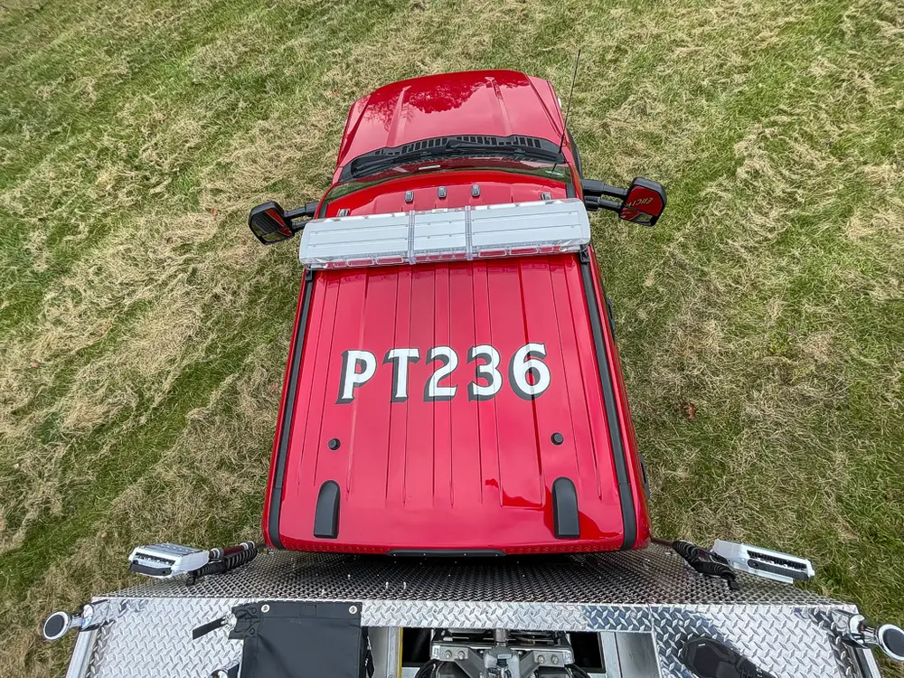 Overhead view of red cab roof from rear deck.