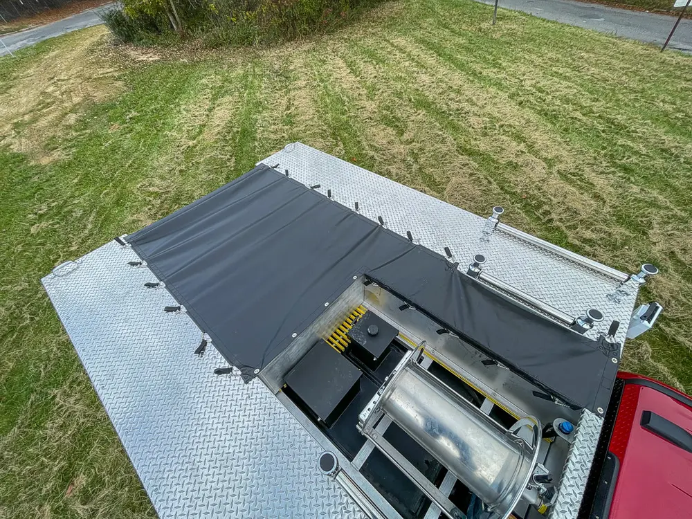 Top deck with side hatch open exposing recessed rear bay.