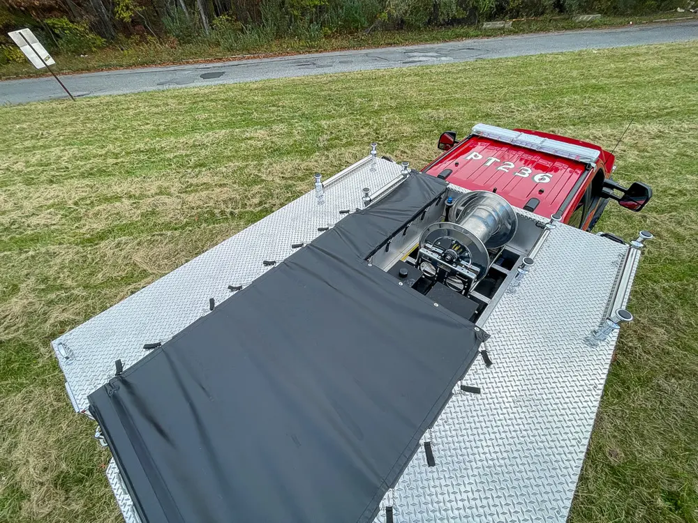 Top deck view with dual black covers over rear equipment area.