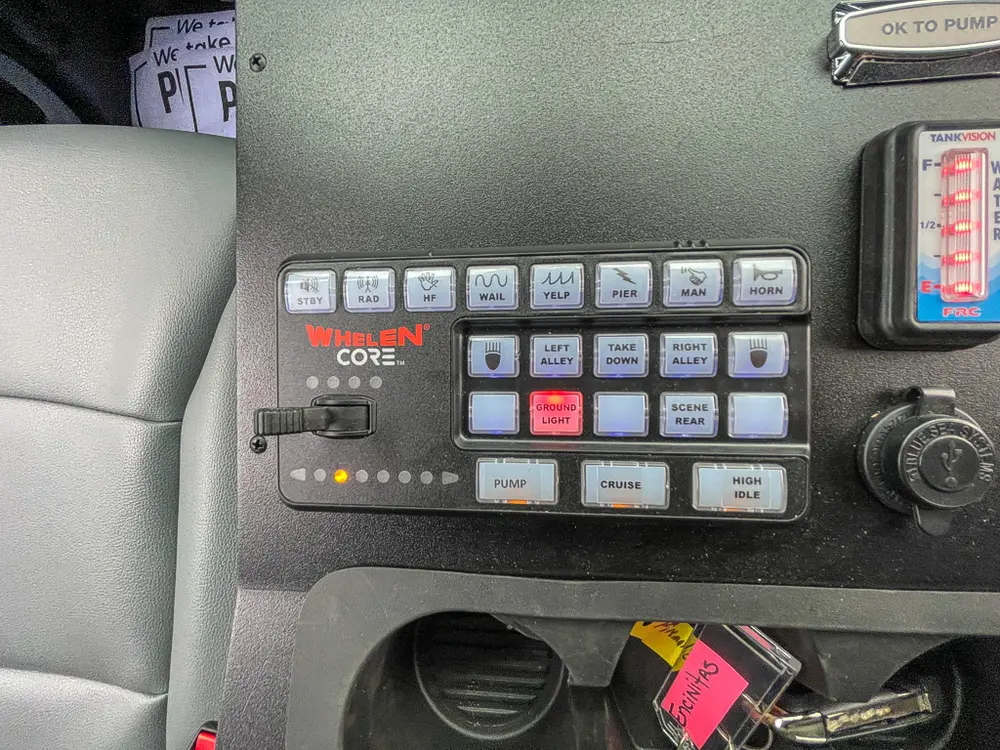 In-cab communication keypad and switch panel close-up.