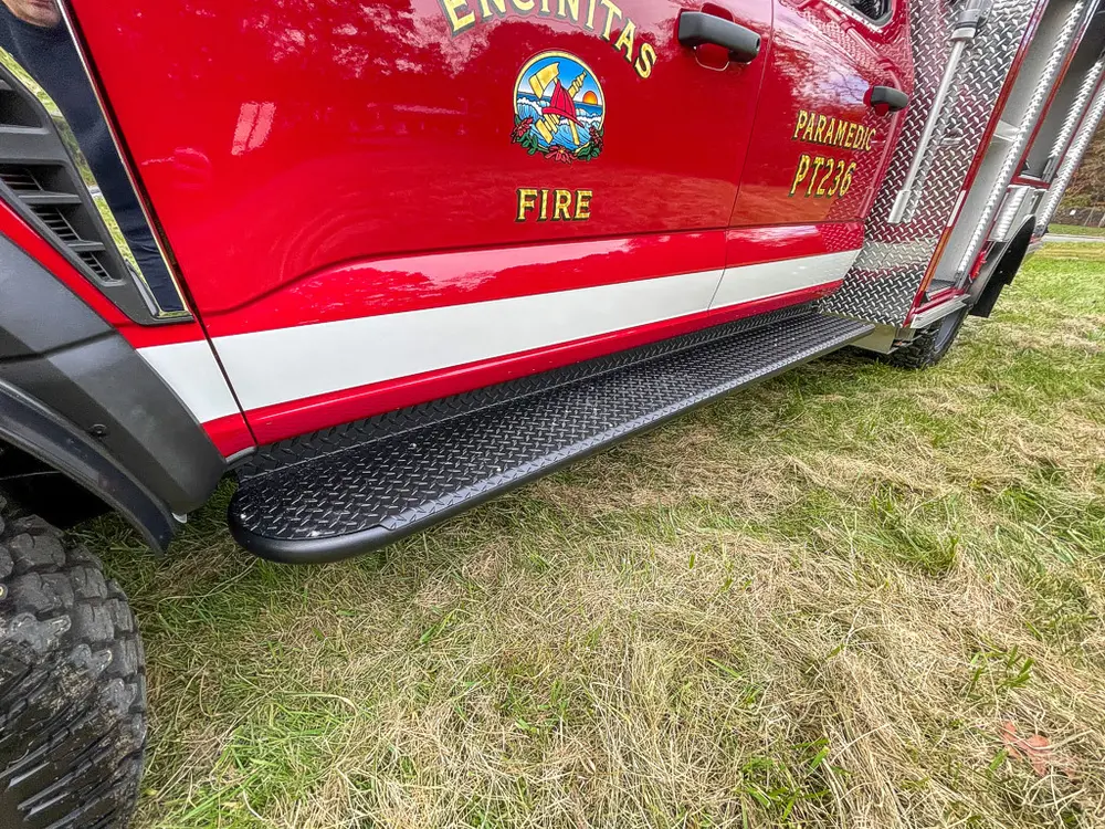 Lower side body with Encinitas Fire crest and step rail.