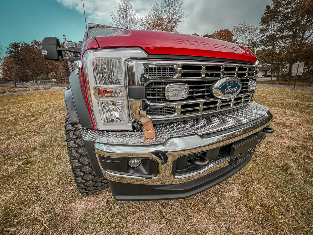 Front grille and bumper close-up from slight driver-side angle.