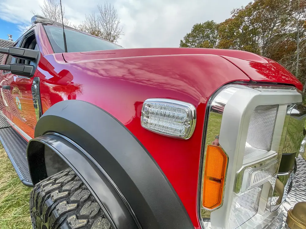 Front passenger-side fender and headlight close-up.