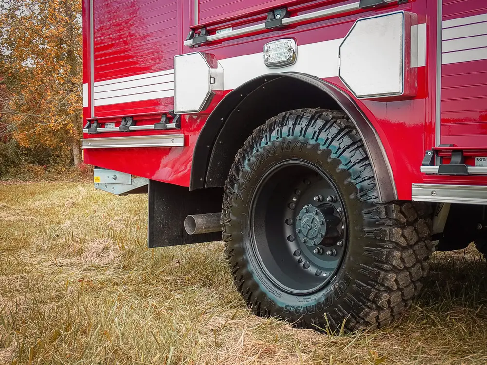 Passenger-side rear wheel and body quarter close-up.