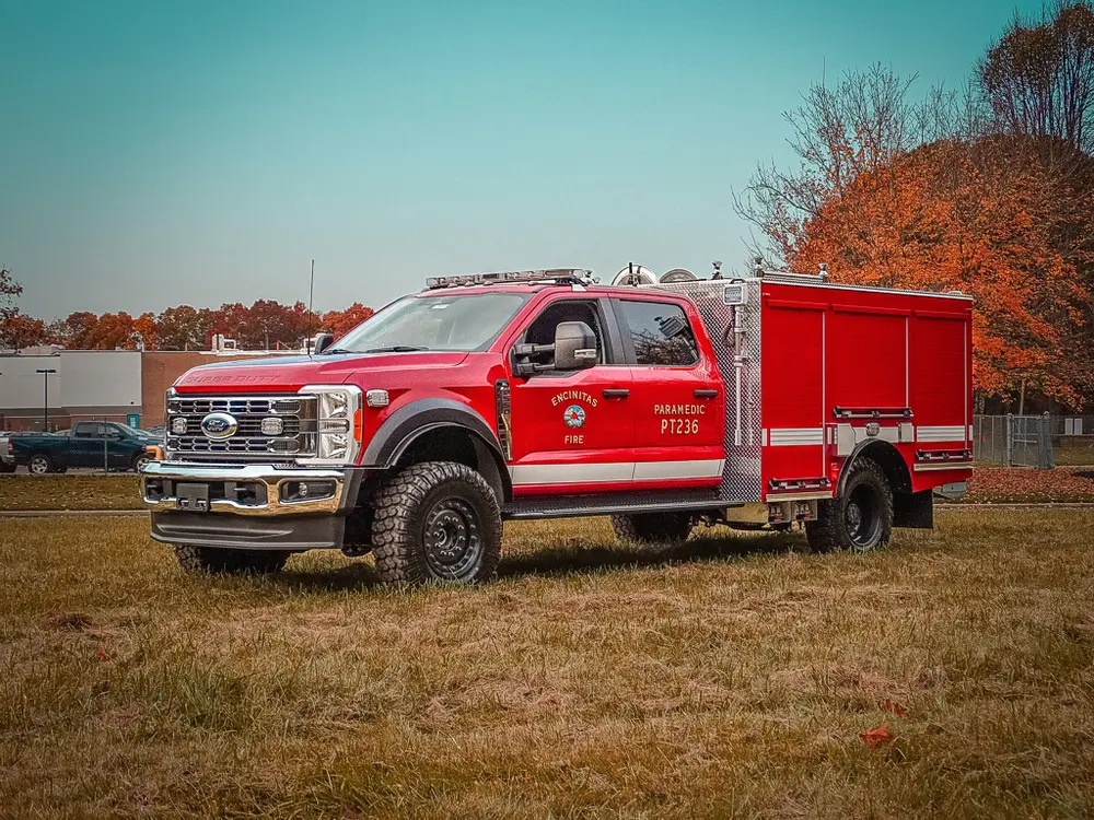 Front driver-side angle showing cab and utility compartments.