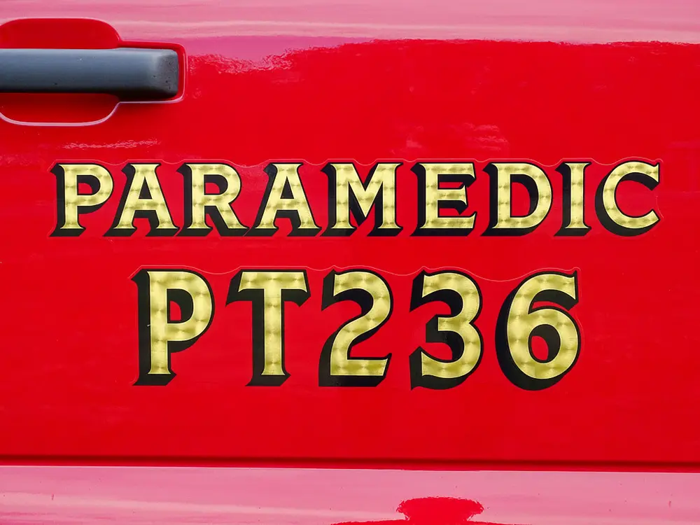 Gold 'Paramedic PT236' lettering on red body panel.