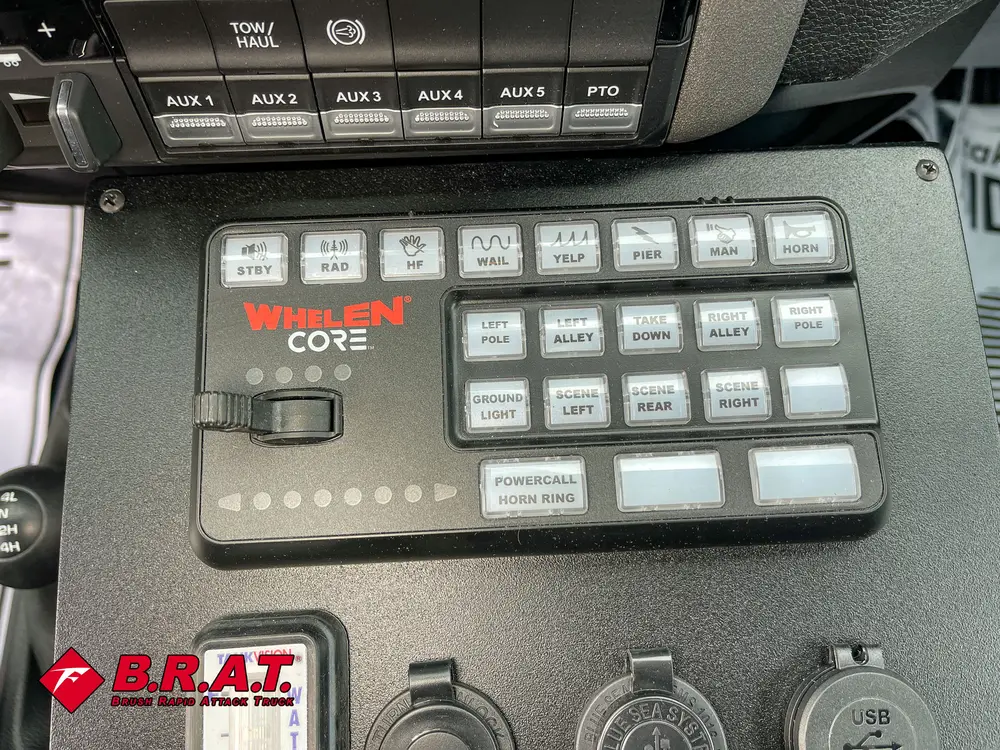 Close-up of in-cab keypad control panel and nearby console buttons.